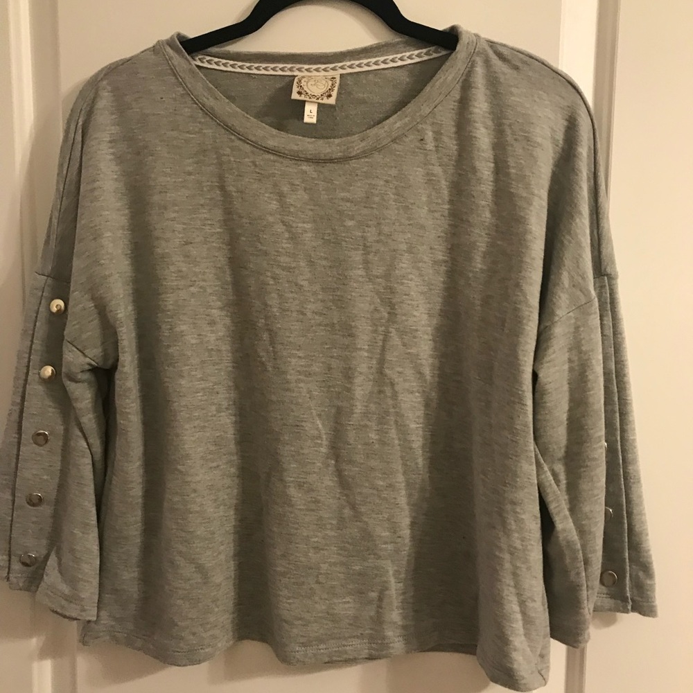 Gray sweater with button up sleeve